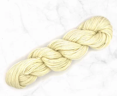 A skein of undyed shetland DK yarn